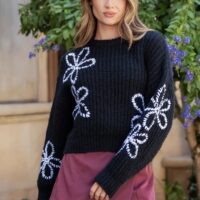 BLACK RIBBED KNIT SWEATER WITH WHITE FLORAL EMBROIDERED PATTERN