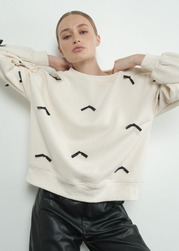 CREAM SWEATSHIRT WITH BLACK SATIN RIBBON ACCENTS